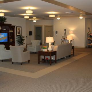 A modern living room with comfortable seating and soft lighting.
