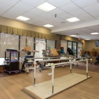 A rehabilitation center with equipment for physical therapy and recovery exercises.