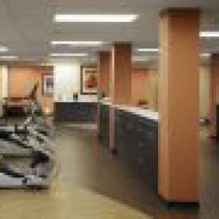 A modern fitness center with treadmills and other exercise equipment.