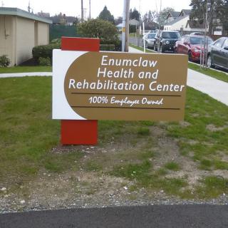 Sign for Enumclaw Health and Rehabilitation Center located outdoors.