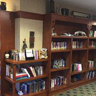 A well-organized library bookshelf filled with a variety of books.