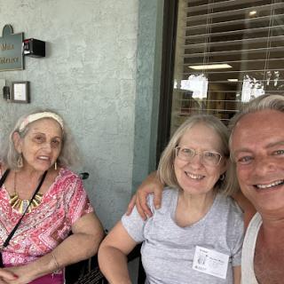 Three friends enjoying a sunny day together.
