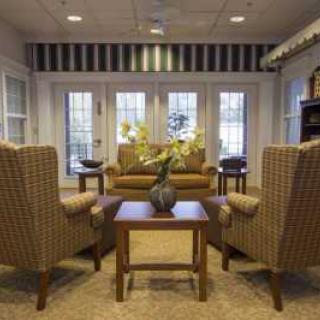 A cozy living room with comfortable seating and elegant decor.
