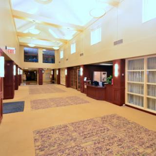 A welcoming hotel lobby with a spacious hallway and modern decor.