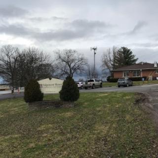 A quiet suburban neighborhood under an overcast sky.