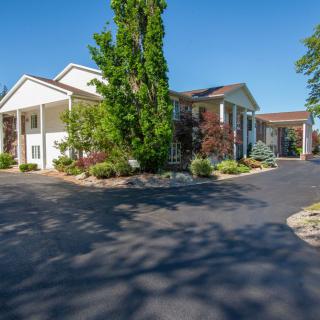 A sunny day at a residential building with well-maintained landscaping.
