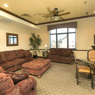 A cozy living room featuring comfortable seating and natural light.