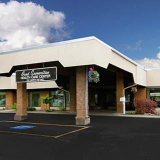 A commercial building with a storefront and parking lot.