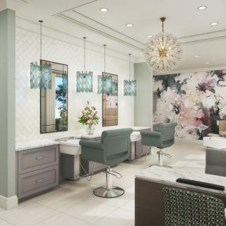 A modern and luxurious salon interior with stylish hairdressing chairs, mirrors, and floral wallpaper.