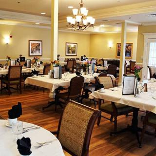 A well-appointed restaurant dining area with neatly arranged tables and elegant decor.