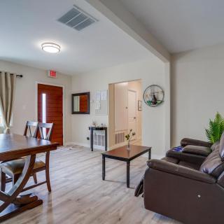 Modern living and dining area with a cozy setup and stylish furniture.