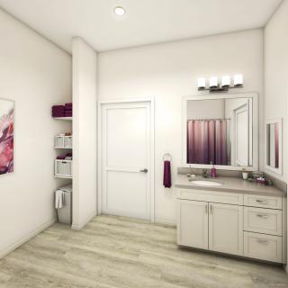 A modern bathroom interior with a vanity and mirror, featuring white walls and wood flooring.