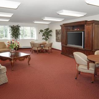 Spacious living room with comfortable seating and a large television.