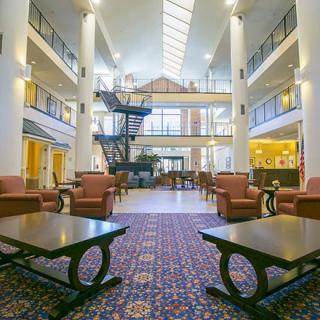 Spacious hotel lobby with comfortable seating and elegant decor.
