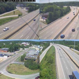 Traffic surveillance view showing multiple angles of a busy highway.