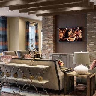 A modern living room with stylish furniture and decorative elements.
