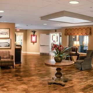 A warmly decorated lobby with comfortable seating and elegant lighting.