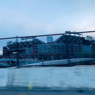 A view of a sports stadium during a cloudy evening.