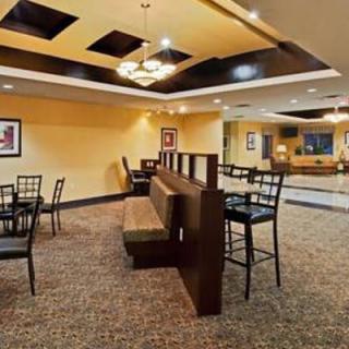 A cozy restaurant interior with booth seating and tables.
