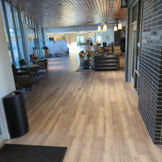A modern lobby area with comfortable seating and large windows.