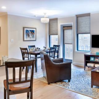 A modern apartment living and dining area with stylish furniture and decor.