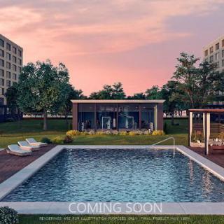 A modern residential area with an outdoor pool at sunset, labeled 'Coming Soon'.