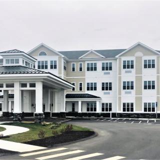 Modern hotel building exterior with a grand entrance.