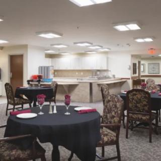 A cozy dining area with neatly set tables and chairs, ready for guests.