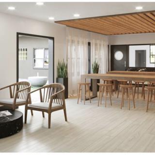 A modern living and dining area with minimalist decor and wooden accents.