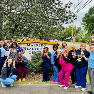 Healthcare professionals celebrating together at Marrero Healthcare Center.