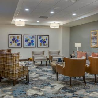 A modern lobby with comfortable seating and artistic decor.
