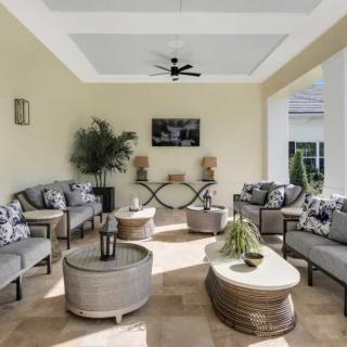 A modern outdoor patio with comfortable seating and stylish decor.