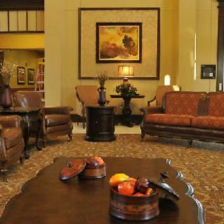A cozy living room with comfortable seating and elegant decor.