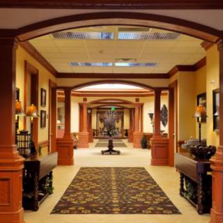 A beautifully decorated hallway featuring wooden accents and symmetrical design.