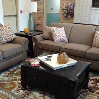 A cozy living room with comfortable sofas and a decorative coffee table.
