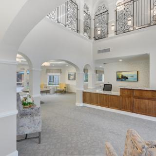 A bright and elegant reception area featuring modern architecture and spacious design.