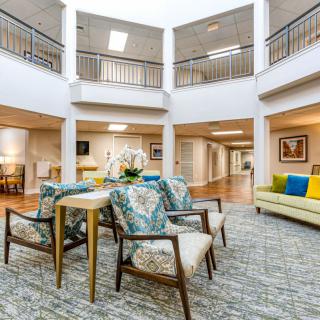 A modern and spacious lobby featuring comfortable seating arrangements and vibrant decor.