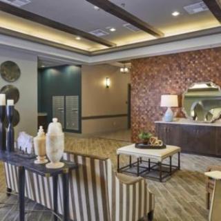 Modern lobby with stylish decor and warm lighting.