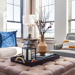 A cozy living room with stylish decor and natural light.