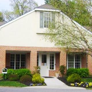 A suburban house with well-maintained landscaping and a welcoming entrance.