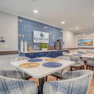 A modern hotel lobby with a stylish seating area and decorative accents.