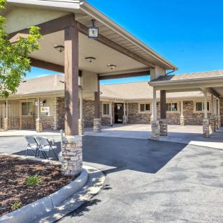 A building entrance with a covered walkway on a sunny day.