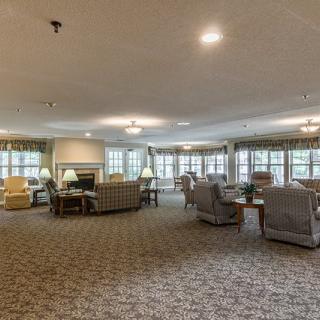 A spacious lobby with comfortable seating and large windows.