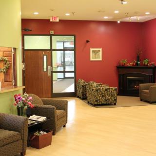 A cozy lobby area with comfortable seating and warm decor.