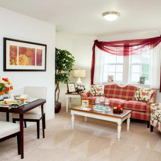 A cozy living room with elegant furniture and a warm color scheme.