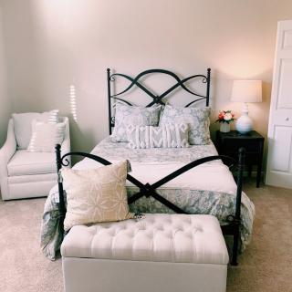 Cozy bedroom with elegant furniture and soft lighting.