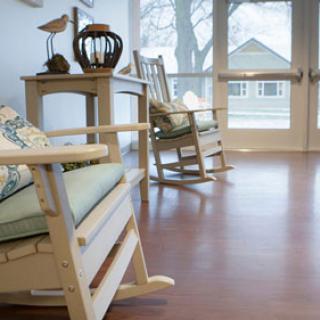 A cozy interior featuring rocking chairs, perfect for relaxation.