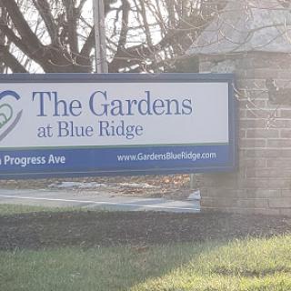 Entrance sign for The Gardens at Blue Ridge on Progress Ave.
