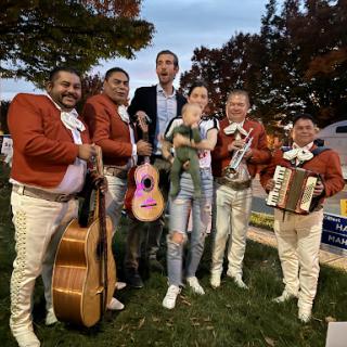 A lively outdoor gathering with a mariachi band, bringing joy and music to the occasion.