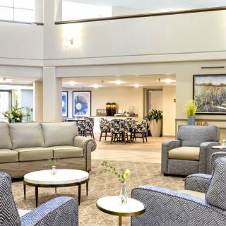 A spacious and modern lobby with comfortable seating areas and elegant decor.